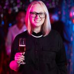 portrait-of-woman-holding-drink-at-party-TBBLMLX.jpg